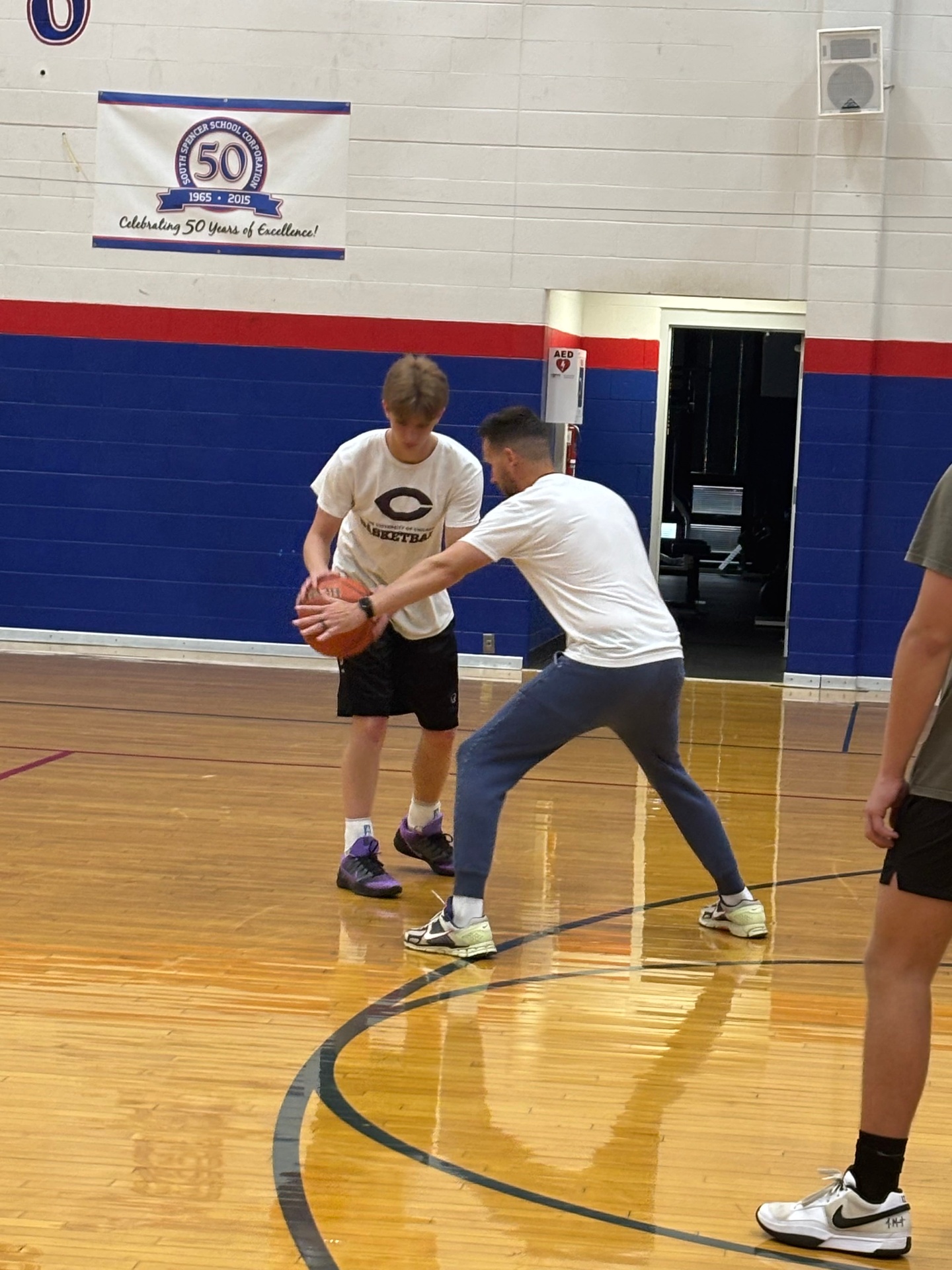 Coach teaching ball protection